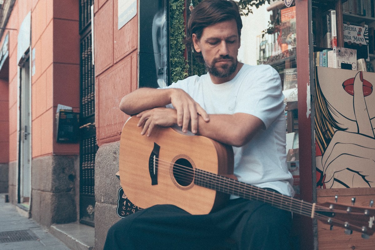 An analog portrait with an acoustic guitar