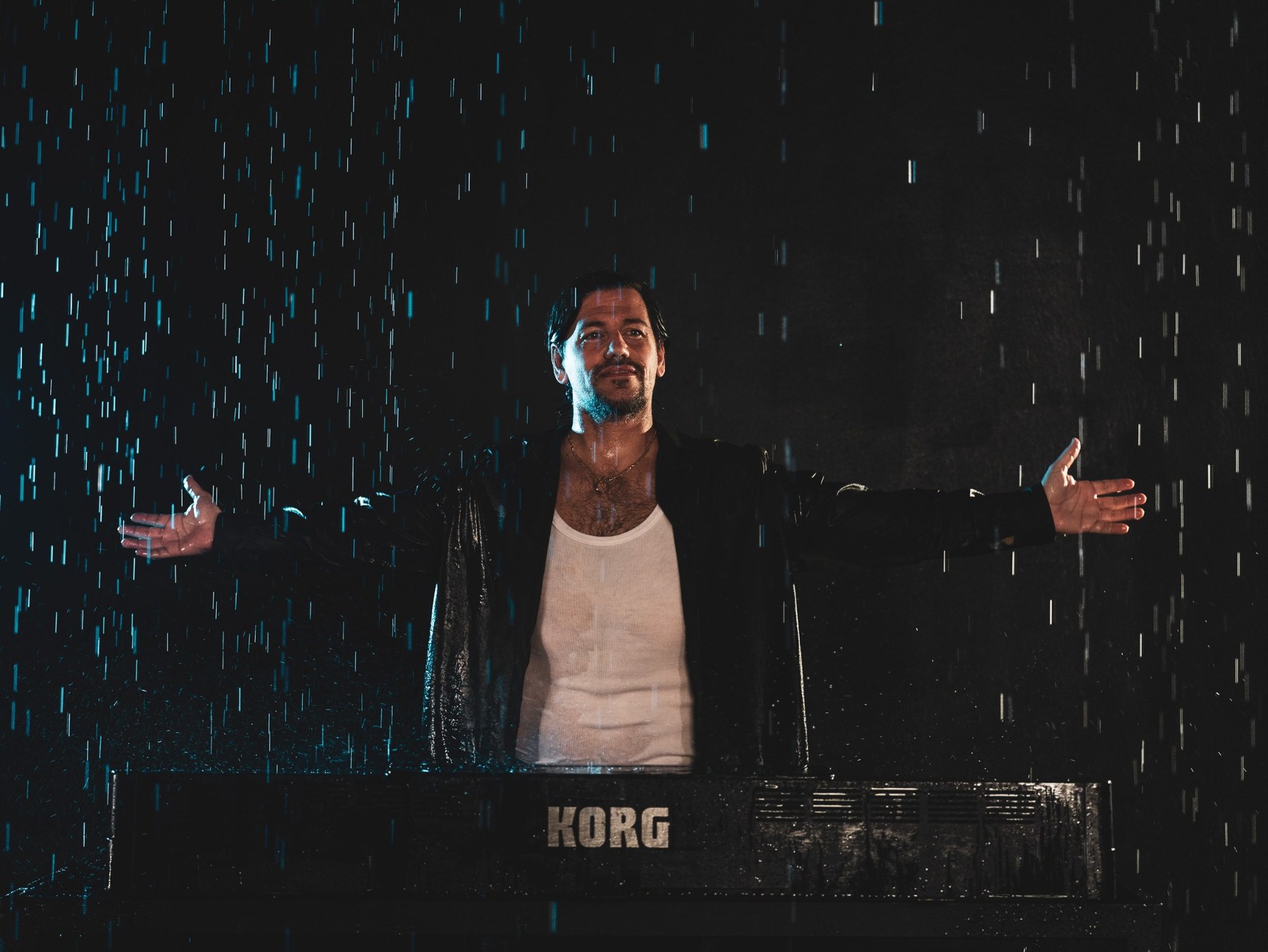A cinematic performance scene in the rain